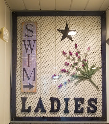 Beautiful sign to ladies restrooms at the pool
