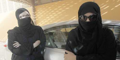 female drivers in saudi arabia, wearing black niqab and chador