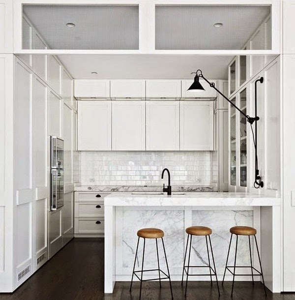 An open dining room (and even living room) kitchen full of light