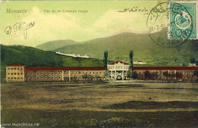 Црвената касарна на разгледница од 1909 година испратена во Париз, Франција, на 31 јули 1910 година со краток текст:Поздрави,Demetrius Phtgas Монастир, 31 /7/1910 Издавач: Attar Faik. Неговата издавачка дејност почнува околу 1908 и трае сé до Балканските војни 1912 година. Сите негови разгледници се во боја - рачно боени, и се на два јазици. Францускиот е секогаш на левата горна страна, а турскиот горе десно, со арапската-старотурската азбука. Бидејќи не постои никаков податок за годината на издавање, според мотивите на самите разгледници и денот на нивното испраќање периодот би бил, како што нагласив, од 1908 до 1912 година. Исто така, и за печатницата во која се печатени овие разгледници немаме никакви податоци, но се работи за печатница од висок квалитет. Неговите разгледници се претежно поврзани со турската армија. Тука се Црвената и Белата касарна, Воената болница, Воената академија, но и објекти и места кои беа карактеристични за градот.