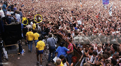 U2's Bono jumped off the stage to pull a fan from the crowd at Live Aid July 13, 1985