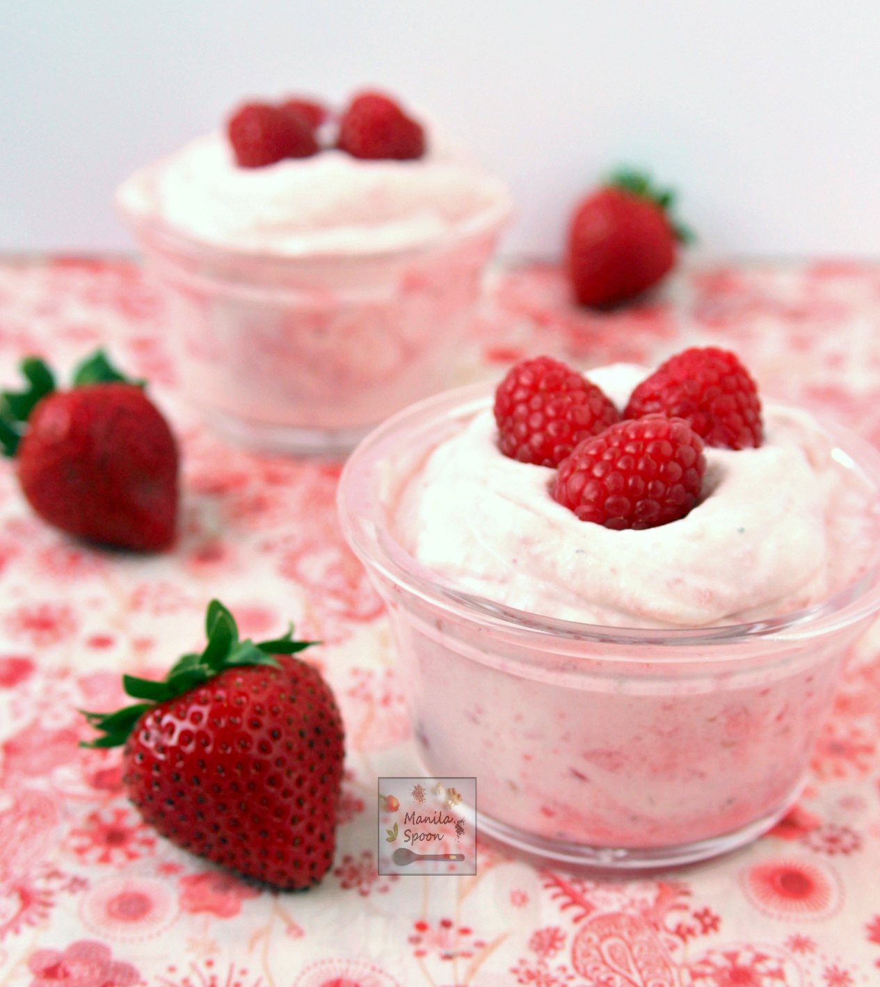 A yummy, quick and super-easy way to enjoy summer berries! Puree the berry or fruit of choice, fold into the sweetened whipped cream and voila - a fruity-licious and creamy Strawberry and Raspberry Fool that everyone will love! #strawberryfool #raspberryfool #englishdessert #summer
