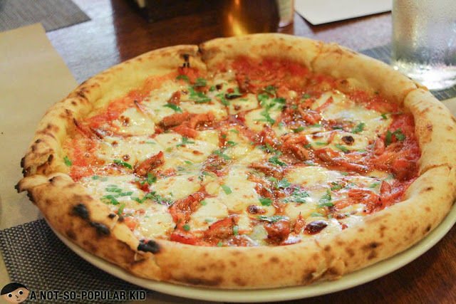The hot Buffalo Pizza of Gino's Brick Oven Pizza