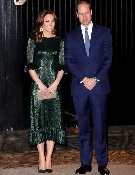 Kate Middleton wore The Vampire's Wife Falconetti emerald midi dress, Brora gold charm earrings. Meghan Markle