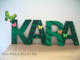 Decorated name sign for a butterfly party at Pams Party and Practical TIps 