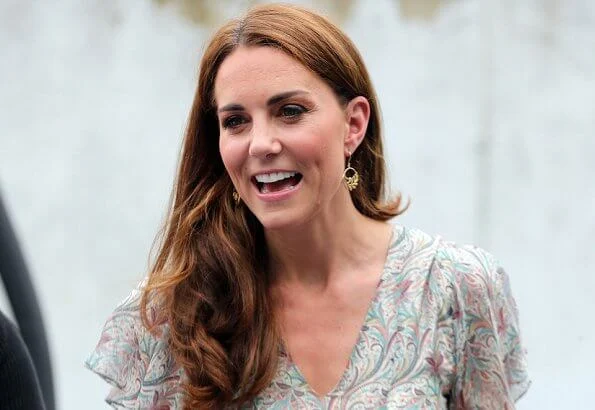 Kate Middleton is wearing a print floral summery midi dress, Castaner wedges and her Catherine Zoraida earrings