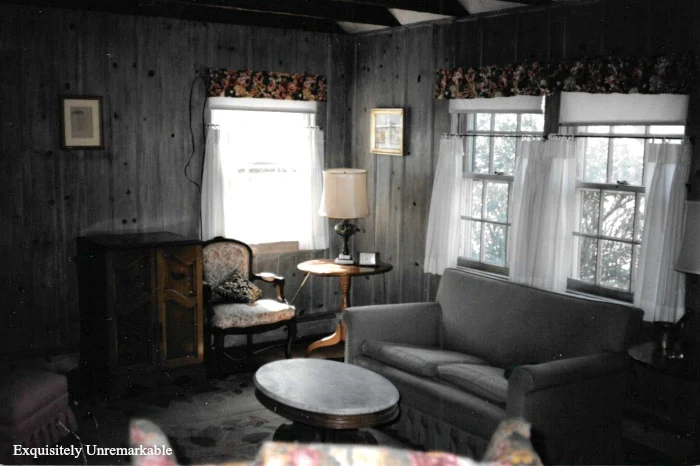 1920s Summer Cottage Living Room with gray painted paneled walls