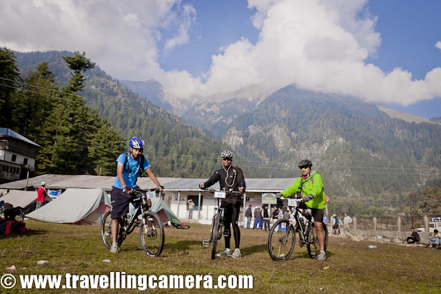 After full day rest at Kullu Sarahan, it was time for get ready for next journey towards Jalori Pass and back to Shimla via Dhomri (Narkanda) ... All the riders were comparatively more energetic and passionate about the stages of MTB Himachal !!! Here is a small PHOTO JOURNEY of 5th day morning, when we had to move towards Bahu !!!It was right time to have some clicks of these riders at this beautiful camping site of Kullu Sarahan... But there was no one to co-ordinate and I was not in a mode to pull each of the rider and ask them to say cheeze... So captured some of them who were around the place...Warm-up sessions at Kullu Sarahan, during Mountain Terrain Biking, Himachal Pradesh-2011 Suddenly more folks from Nepal team, Army group and Noida gang joined in and happily cheering for our next journey of Mountain Terrain Biking Himachal 2011...Here come the Army team and Monika hopping in with big cheer for the team !!!Route of Day-5 of Mountain Terrains Biking, Himachal Pradesh, 2011 was ::Bagipul == Urtu == Garshaain == Damah == Kandagahi == Amarbaag == Chuaai ==Shamshar == BaahoSudhir, Vikas, Gouri and Siddhartha - The Noida Gang at Mountain Terrain Biking, Himachal Pradesh, 2011 !!!Our own, Mr. Darshan Singh Ji... He was comfortably dragging his cycle on this bridge and picked it up after seeing the Travelling-Camera !!!This lady was here to participate and had come with her little baby. During day time, one of her relative used to take care of this baby. She used to find some time during free stages to meet him and make sure that everything is fine. Unfortunately on last day, baby had very high fever and she had to quit the race in between.Sarahan goats are coming towards our camps to wish good luck for next journey of MTB Himachal 2011 !!Ohh.. Here are our Marshals !!! Arjun had posed for his photograph but most of us were not aware that why he is standing like this :) ...Finally he got this opportunity of posing again.. that's too with black ScorpiowithOfficial sticker on it :) ... Yo Man !!!Mr. Gagan also wanted to have a similar shot but Arjun also chipped in :)