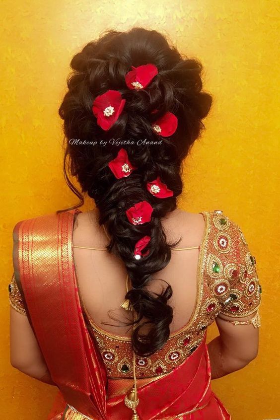 modernbraidedbunindianreceptionbridalhairstyleforsaree  WedAbout