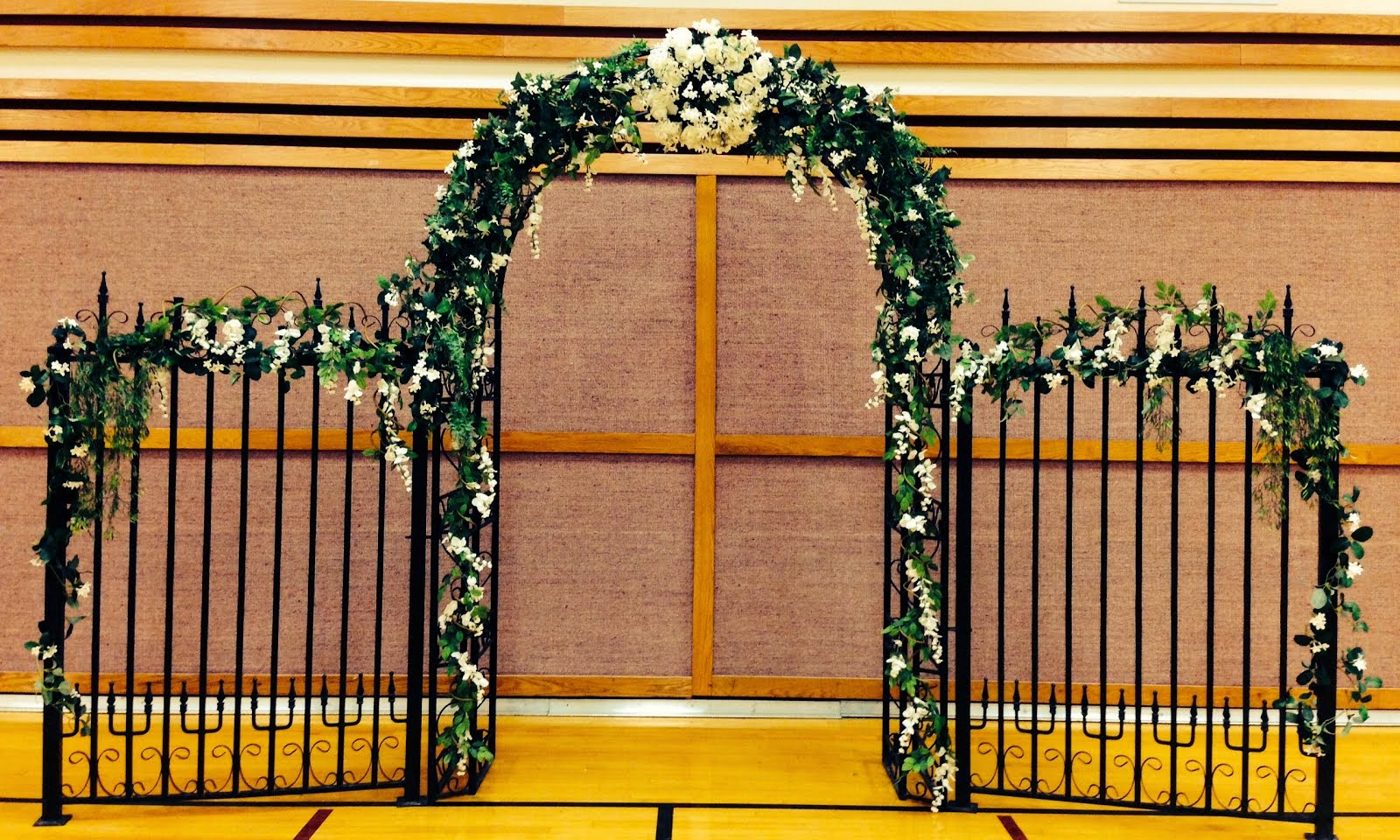 9' H x 14' W backdrop available to rent!  Comes with white flowers & greenery, lighting optional