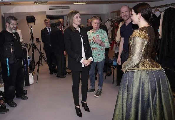 Queen Letizia wore ZARA Military Jacket, Queen Letizia wore Hugo Boss ankle boots and carried Hugo Boss Fanila clutch