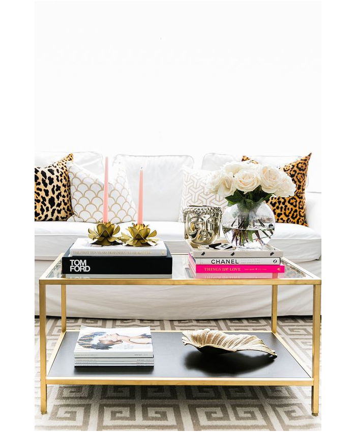 leopard pillows, gold brass cocktail table, tom ford table book, white sofa