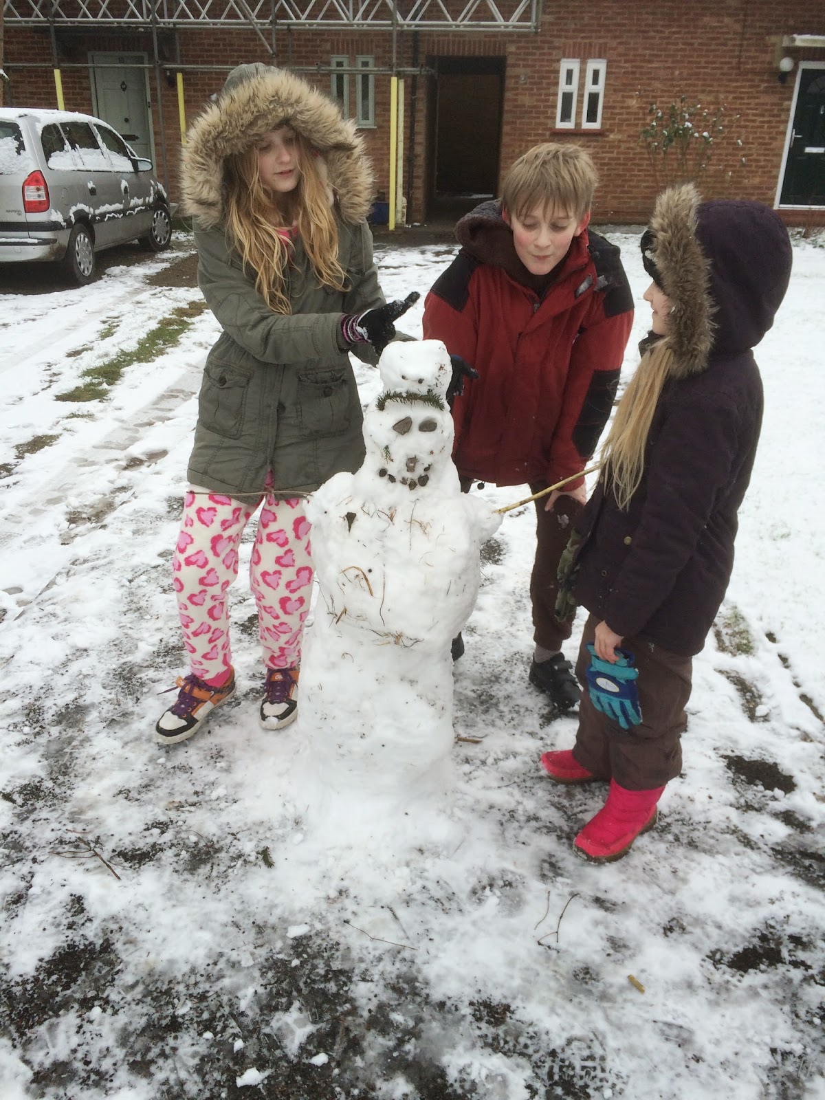 children building snowman