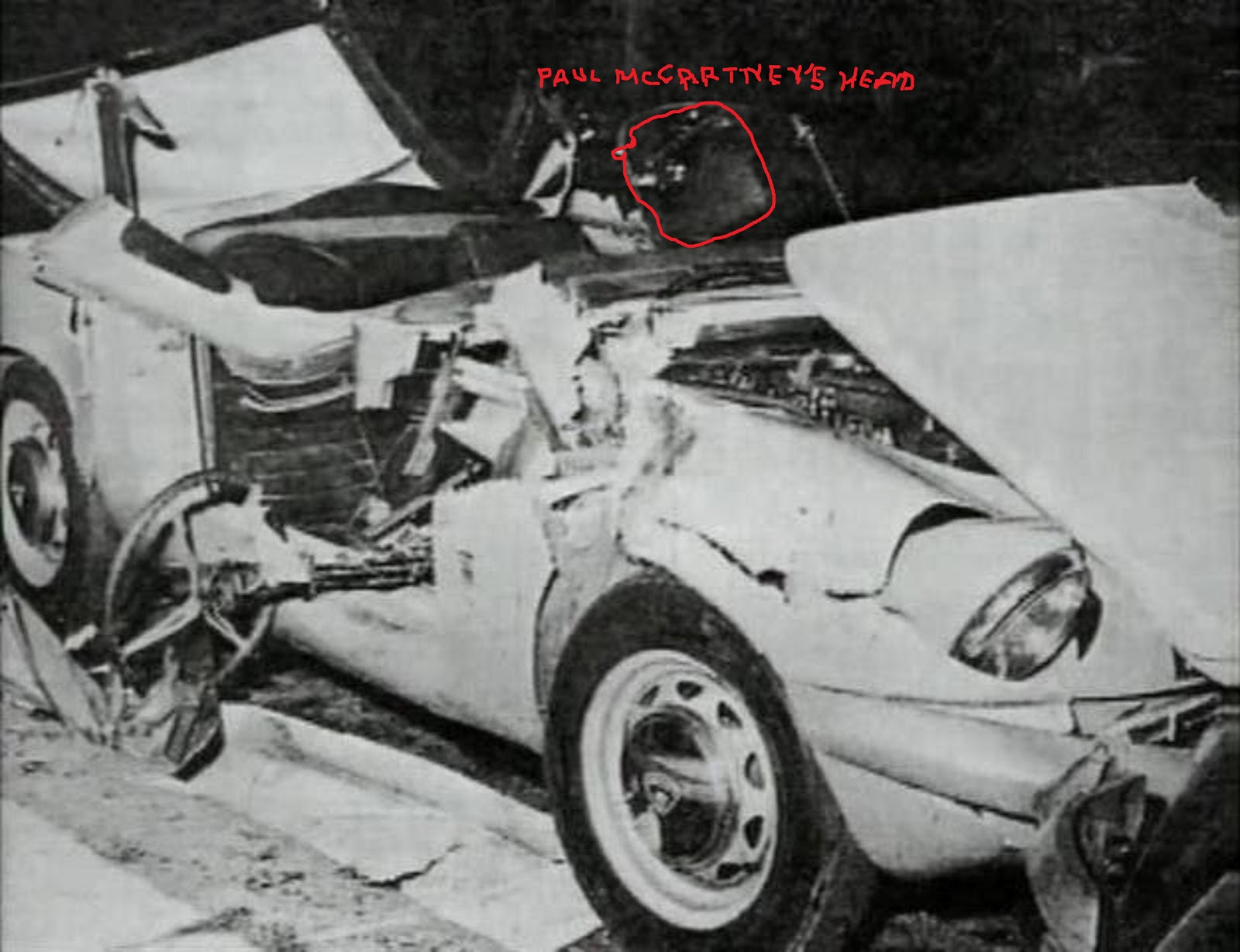 PAUL McCARTNEY'S WRECKED CAR WITH PAUL'S HEAR ON SEPTEMBER 11, 1966