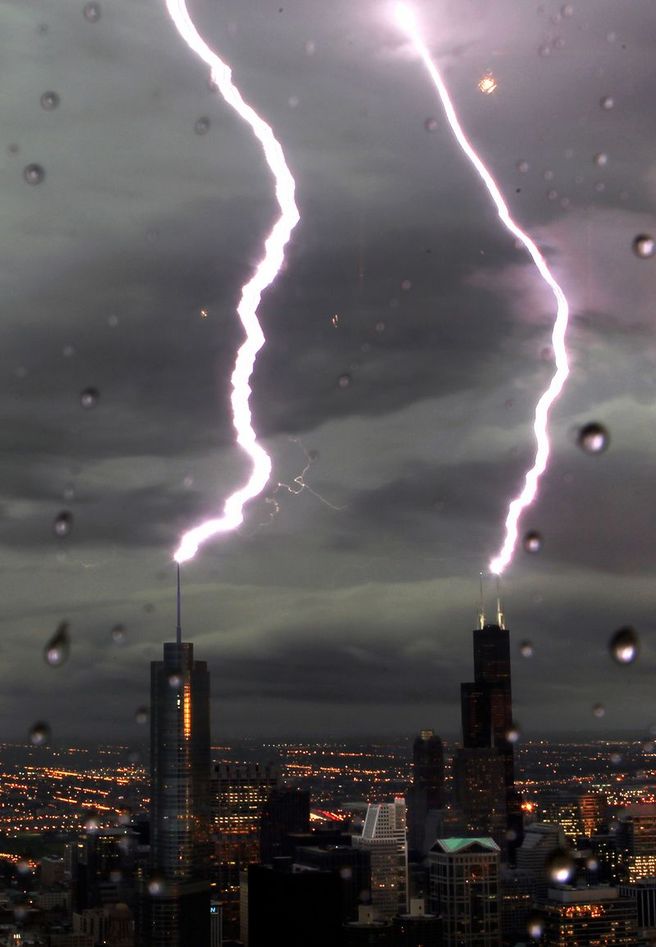 lightning strikes strike building cities tower chicago trump willis sears hancock night storm lighting towers twin downtown john lightening bolts