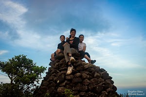 Girls sat on the top most rock at Kumara Parvatha peak