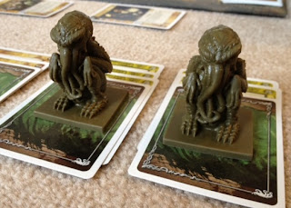 Cthulhu figures from card game