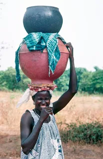 Woman carrying water in Mali Africa 1983
