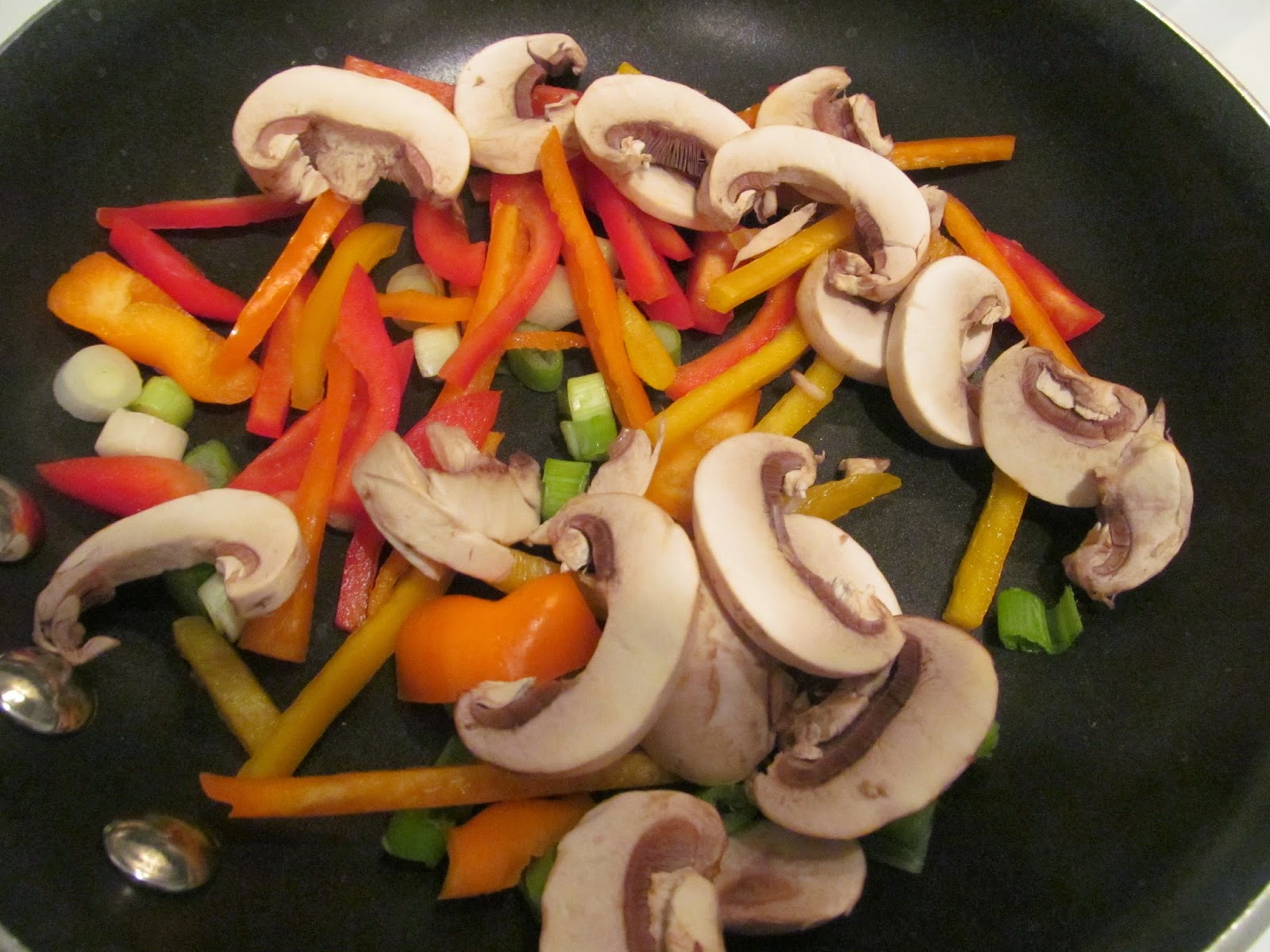 peppers, scallions, mushrooms cooking