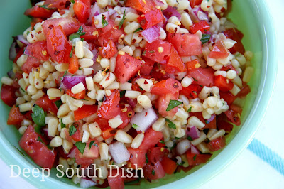 Garden fresh corn, sweet bell peppers, tomatoes and some red onion, combine with a sweet and sour vinegar and oil dressing for a wonderful summer salad!