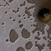 A South Polar Pit on Mars or an Impact Crater?