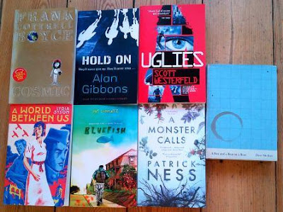Covers for Cosmic by Frank Cottrell Boyce, A World Between Us by Lydia Syson, Bluefish by Pat Schmatz, A Monster Calls by Patrick Ness, Hold On by Alan Gibbons and Uglies by Scott Westerfeld