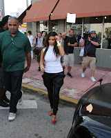 Kim Kardashian with a bodyguard