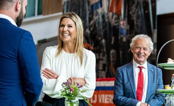 Queen Maxima's outfit is by Belgian fashion house Natan. Queen Maxima wore a silk blouse and wide leg trousers from Natan