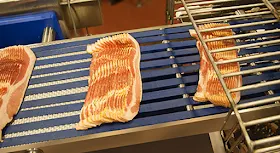 Sugardale bacon on the slicer at Fresh Mark Company, Massillon Ohio
