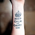 Keep calm and carry on ink tattoo with crown on wrist