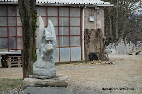 A now-goggled Pinocchio rides on the dove- stone sculpture Cava Nardini