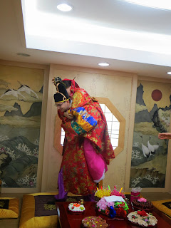 Traditional Korean wedding ceremony at wedding hall - piggy back ride