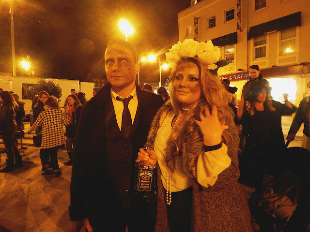Two people dressed as zombies
