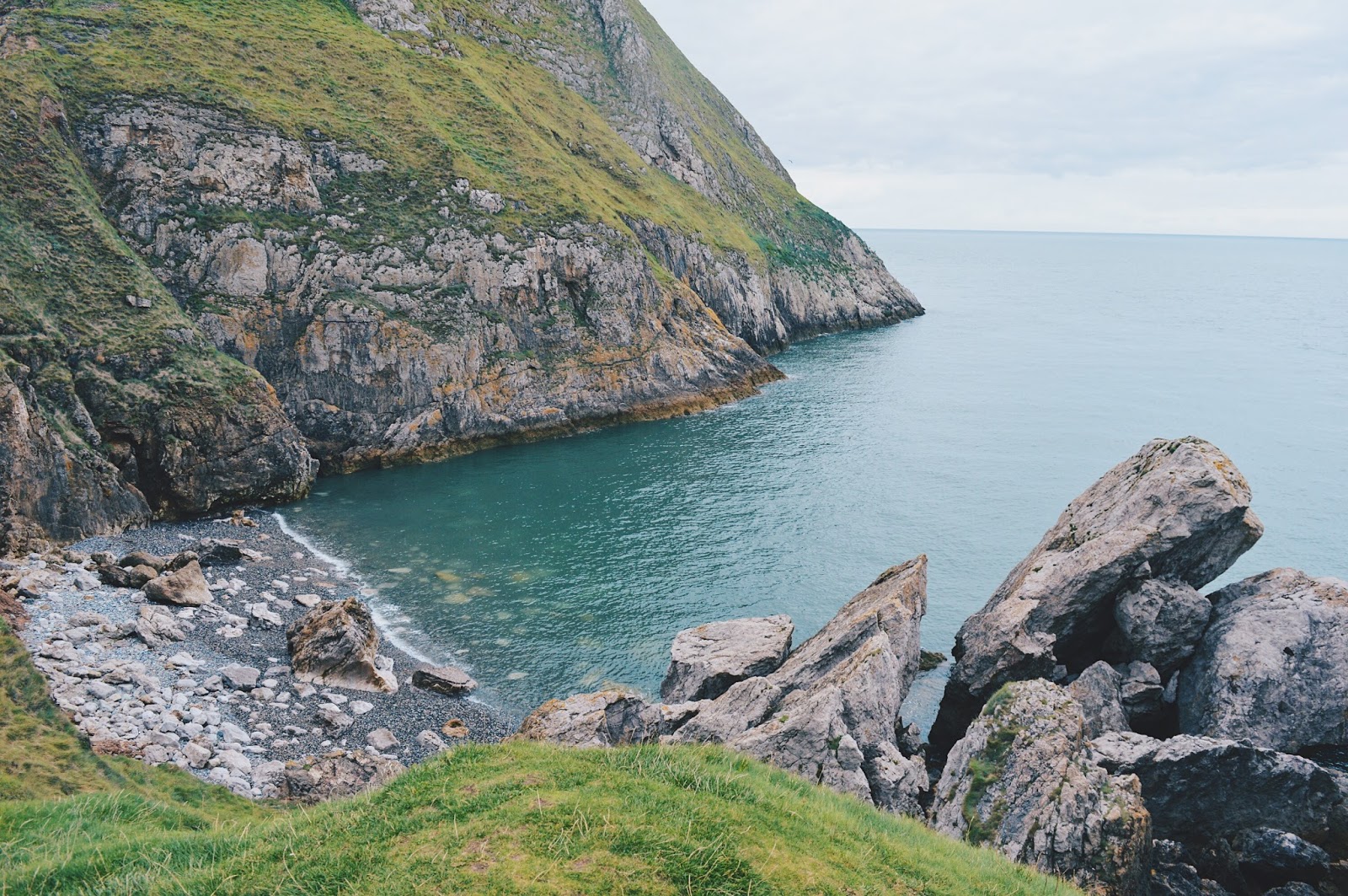 Blue water and coast cliffs