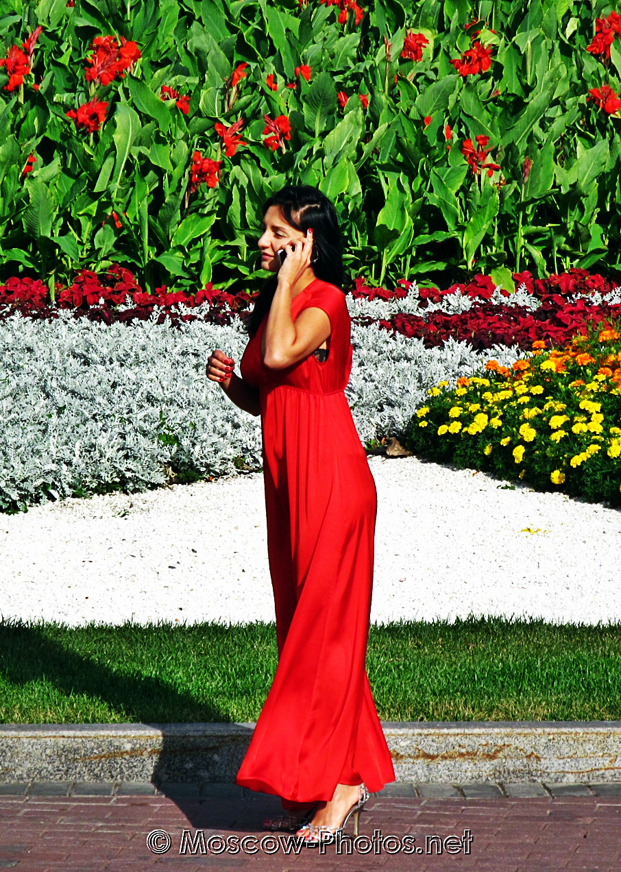 Lady in party red dress and flowers  