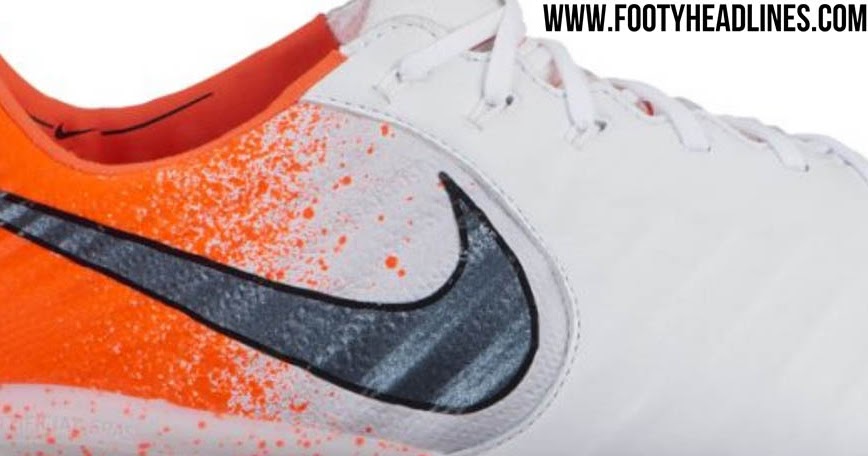 orange and white nike tiempo
