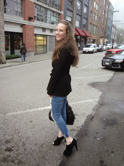 Alley in Vancouver, ripped blue jeans, black jacket, black purse, black heels