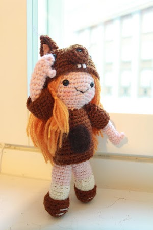 Amigurumi squirrel girl standing and saluting