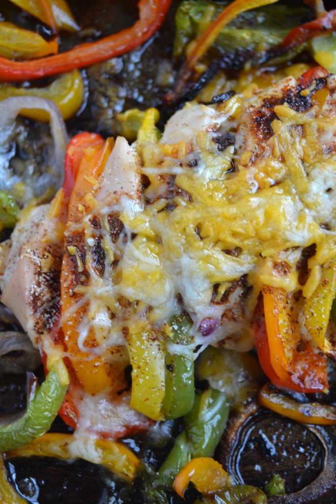 Hasselback Fajita Chicken features bell pepper and onion stuffed chicken breasts with fajita seasonings and melted cheese along with roasted peppers and onions all cooked on one pan for an easy and flavorful meal! www.nutritionistreviews.com