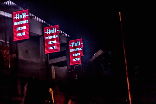 Sign board of Hyderabad biriyani house in Coonoor. Photo taken during night