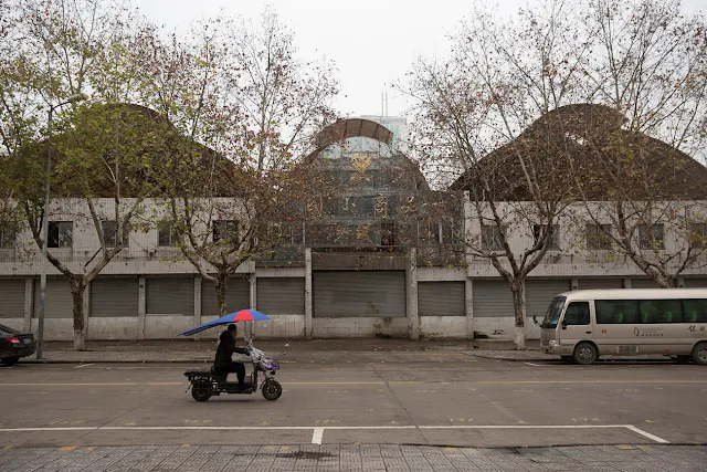 A motorcycle passes a closed-down warehouse in Yiwu, Zhejiang Province,China 19 January 2017. To match story CHINA-MIGRANTS/MIDEAST Thomson Reuters Foundation/Shanshan Chen