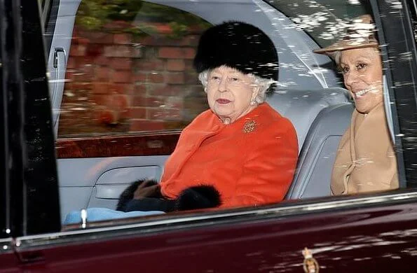 The Queen wore a bright orange jacket and a furry black hat, while Princess Anne donned a  navy coat.  Dame Kiri Te Kanawa