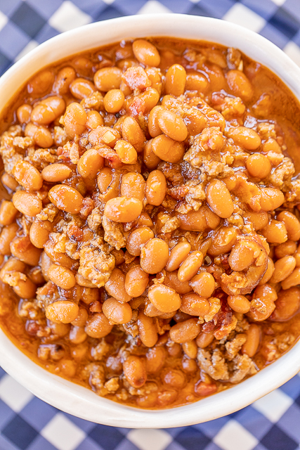 Instant Pot Baked Beans - seriously the BEST baked beans I've ever eaten!!! I could make a meal out of these yummy beans! Loaded with beef and bacon. SO easy to make! Great for potlucks and cookouts. Ground beef, bacon, onion, baked beans, ketchup, mustard, beef broth, garlic, brown sugar. I took these to a cookout and everyone asked for the recipe. A new favorite!! #instantpot #bakedbeans #cookout #sidedish baked beans with ground beef and bacon