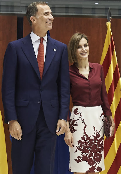 Queen Letizia attended an official lunch for Constitutional Tribunal. Felipe Varela satin blouse and floral skirt