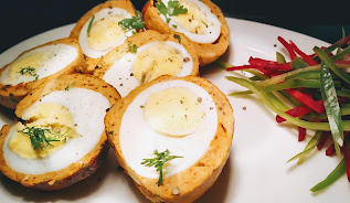 Scotch Egg  cut into half and garnished for scotch eggs recipe