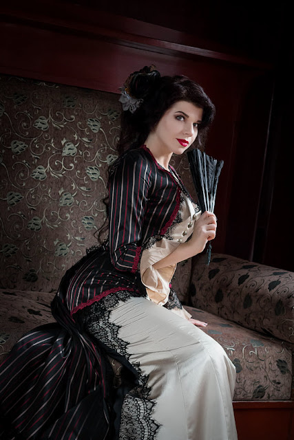 Women's steampunk victorian clothing. red, black and white striped jacket and mermaid skirt.