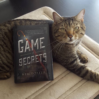 Pickles putting his serious face on for Game of Secrets! Pickles with Game of Secrets.