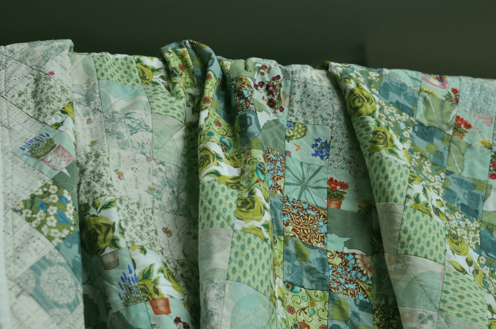 COLOURS AND FABRICS The green quilt top turned into a quilt