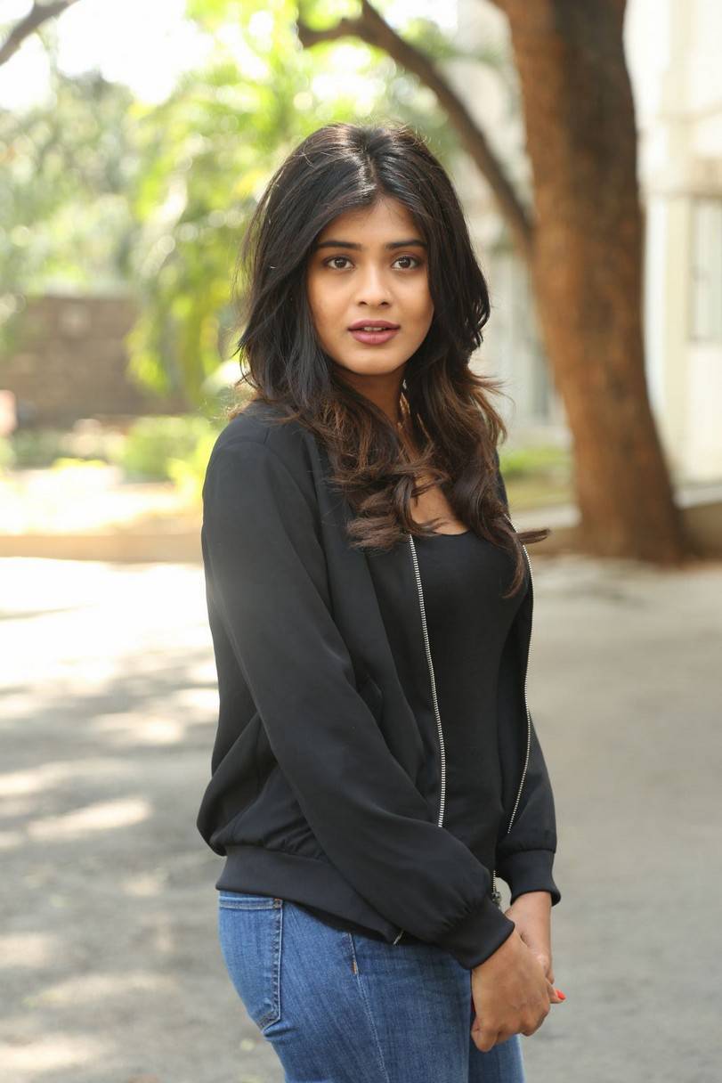 Actress Hebah Patel Long Hair In Black Top Blue Jeans
