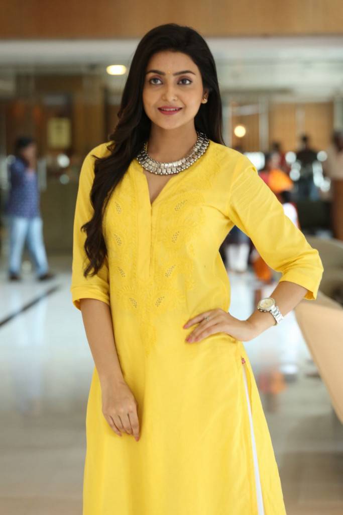 Indian Film Actress Avantika Mishra Long Hair Stills In Yellow Dress